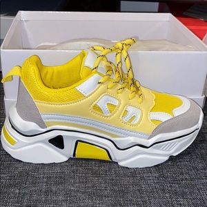Yellow and white sport sneakers